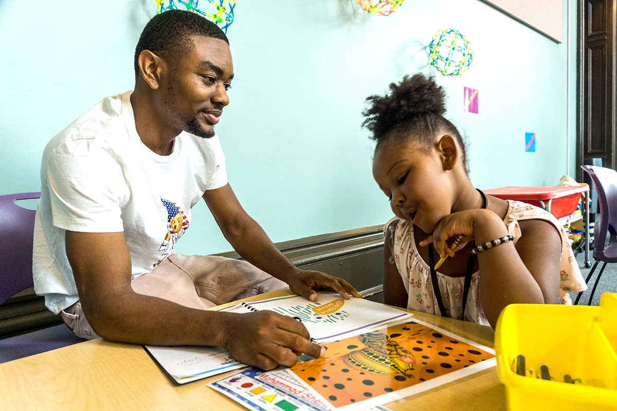 Kindergarten caregiver and student